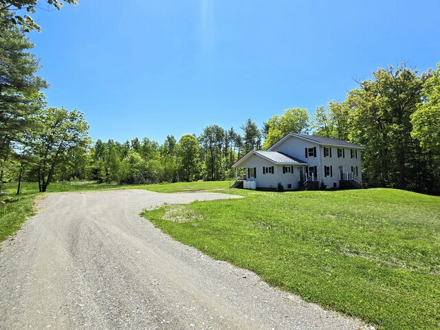 237 Bangor Rd, Unity, ME 04988 - view of side of home featuring dirt driveway and a yard