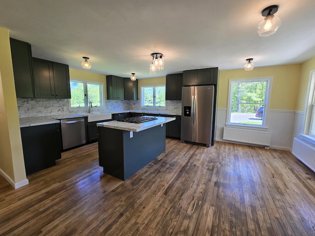 237 Bangor Rd, Unity, ME 04988 - kitchen with stainless steel appliances, radiator, a sink, dark wood-style floors, and light countertops