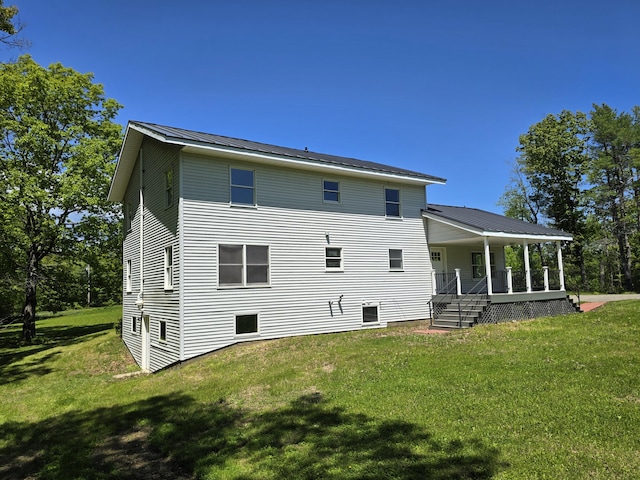237 Bangor Rd, Unity, ME 04988 - back of property with covered porch and a yard