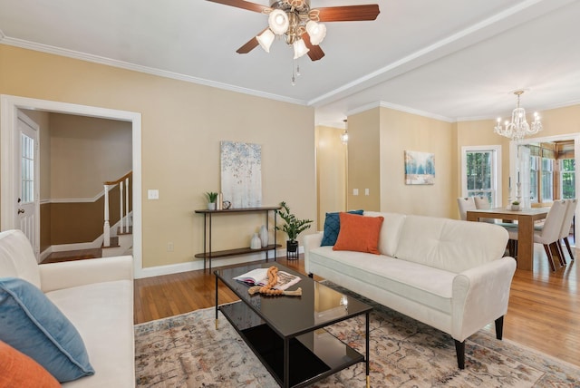 10 Ledge Hill Rd, Gorham, ME 04038 - living area featuring wood finished floors, a chandelier, stairway, a ceiling fan, and ornamental molding