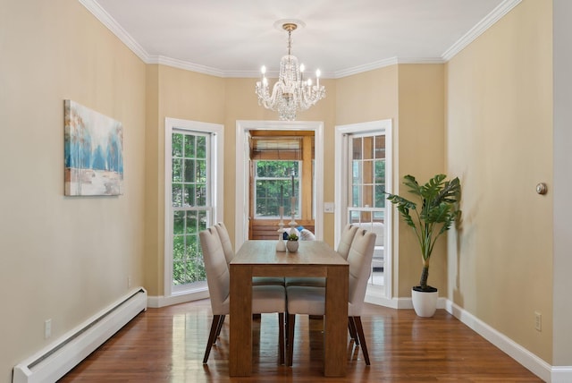10 Ledge Hill Rd, Gorham, ME 04038 - dining room featuring baseboard heating, a chandelier, wood finished floors, baseboards, and crown molding