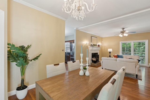 10 Ledge Hill Rd, Gorham, ME 04038 - dining area featuring plenty of natural light, a fireplace, wood finished floors, ceiling fan, and ornamental molding