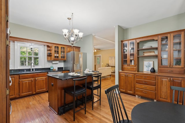 10 Ledge Hill Rd, Gorham, ME 04038 - kitchen with a sink, stainless steel appliances, open shelves, a chandelier, and a kitchen breakfast bar