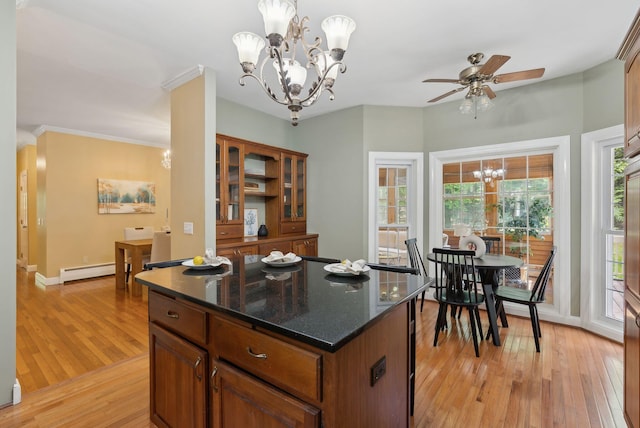 10 Ledge Hill Rd, Gorham, ME 04038 - kitchen featuring a chandelier, a baseboard radiator, light wood finished floors, brown cabinetry, and crown molding