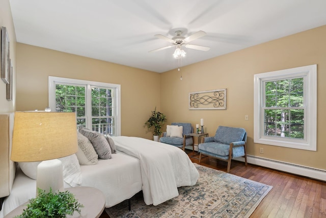 10 Ledge Hill Rd, Gorham, ME 04038 - bedroom featuring hardwood / wood-style flooring and a baseboard radiator