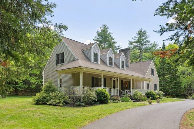 10 Ledge Hill Rd, Gorham, ME 04038 - cape cod house featuring covered porch, a front yard, a shingled roof, and a chimney