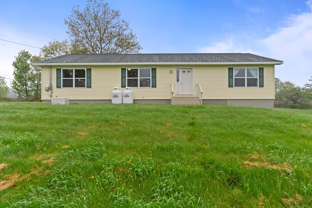 509 Lowelltown Rd, Wiscasset, ME 04578 - view of front of house featuring entry steps, a front lawn, and roof with shingles