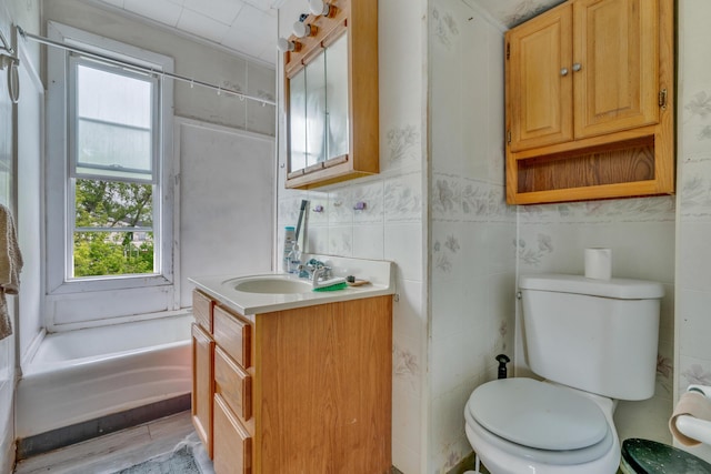 74 King Ave, Lewiston, ME 04240 - bathroom featuring toilet, vanity, and a tub