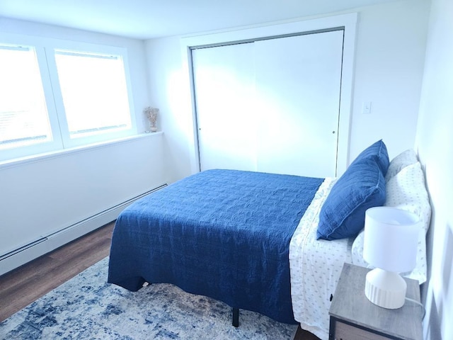 262 Golf Course Rd, Newport, ME 04953 - bedroom with wood finished floors and baseboard heating