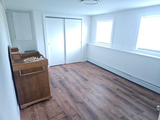 262 Golf Course Rd, Newport, ME 04953 - bedroom featuring a baseboard radiator, a closet, and wood finished floors