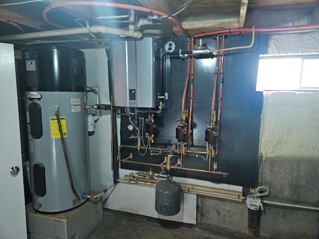 262 Golf Course Rd, Newport, ME 04953 - utility room featuring water heater and tankless water heater