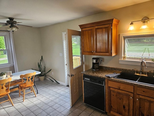 262 Golf Course Rd, Newport, ME 04953 - kitchen with black dishwasher, a sink, dark countertops, light tile patterned floors, and brown cabinets