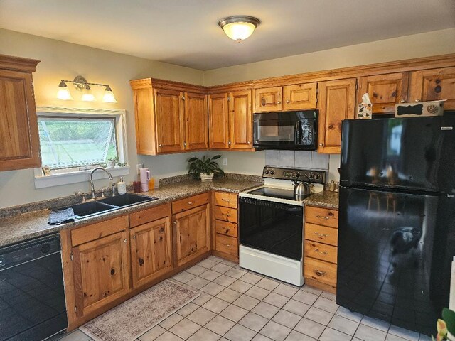 262 Golf Course Rd, Newport, ME 04953 - kitchen featuring black appliances, a sink, and brown cabinets