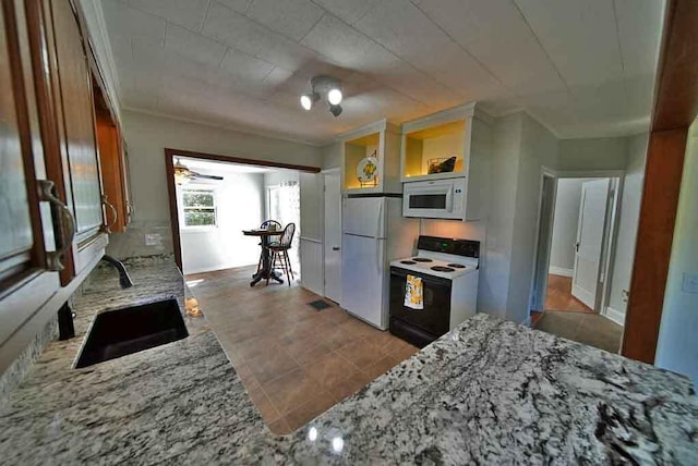 6 Pleasant Ct, Houlton, ME 04730 - kitchen with white appliances, a sink, light stone countertops, and open shelves