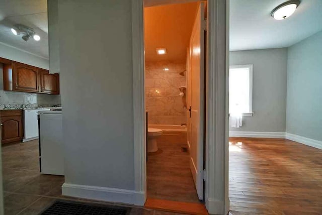 6 Pleasant Ct, Houlton, ME 04730 - corridor with baseboards and dark wood-style floors