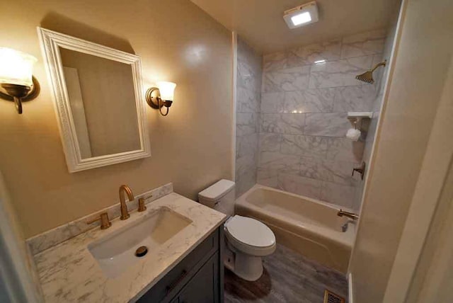 6 Pleasant Ct, Houlton, ME 04730 - full bathroom featuring vanity, toilet, shower / washtub combination, and wood finished floors