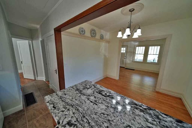 6 Pleasant Ct, Houlton, ME 04730 - dining room with a chandelier and baseboards