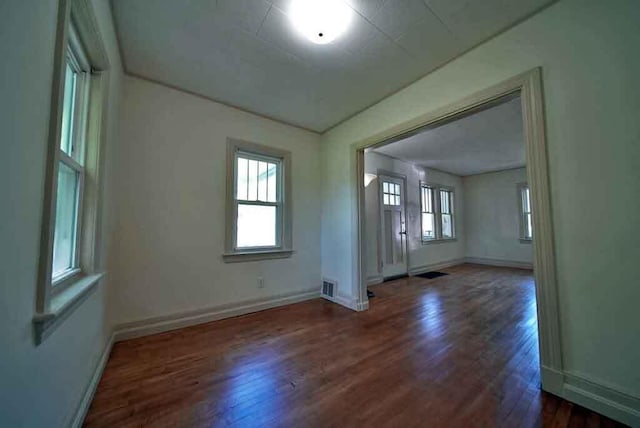 6 Pleasant Ct, Houlton, ME 04730 - unfurnished room featuring wood finished floors, healthy amount of natural light, and baseboards