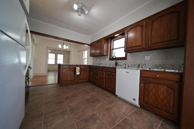 6 Pleasant Ct, Houlton, ME 04730 - kitchen with white appliances, a chandelier, a peninsula, healthy amount of natural light, and ornamental molding