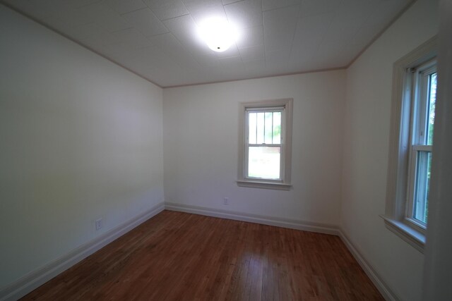 6 Pleasant Ct, Houlton, ME 04730 - spare room with wood finished floors, baseboards, and crown molding