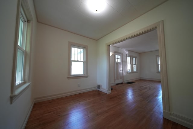 6 Pleasant Ct, Houlton, ME 04730 - empty room featuring hardwood / wood-style floors, healthy amount of natural light, and baseboards