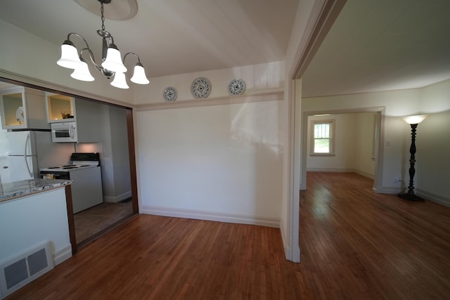 6 Pleasant Ct, Houlton, ME 04730 - kitchen featuring white appliances, a chandelier, wood finished floors, pendant lighting, and baseboards