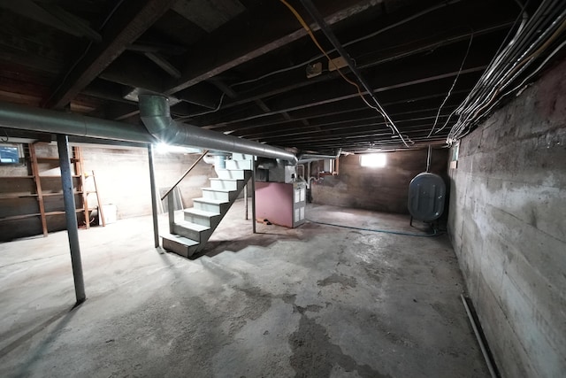 6 Pleasant Ct, Houlton, ME 04730 - unfinished below grade area with oil tank, stairway, and heating unit