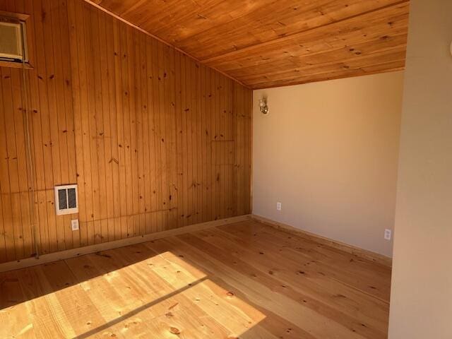 20 Monument Rd, Abbot, ME 04406 - spare room with wood finished floors, wooden ceiling, wooden walls, and baseboards