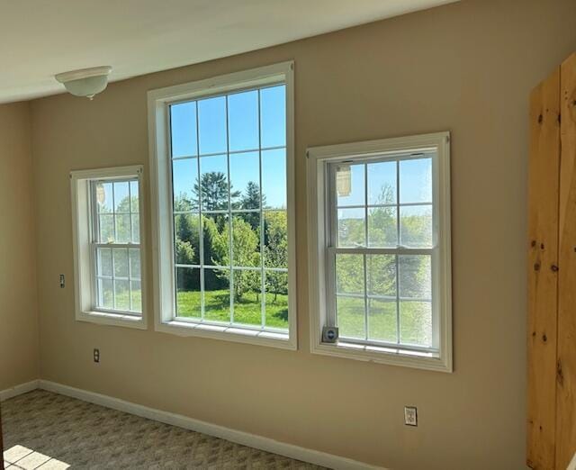 20 Monument Rd, Abbot, ME 04406 - doorway featuring baseboards and carpet flooring
