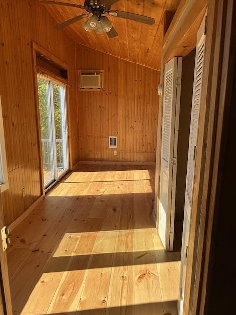 20 Monument Rd, Abbot, ME 04406 - corridor with wooden walls, vaulted ceiling, wood-type flooring, and wood ceiling