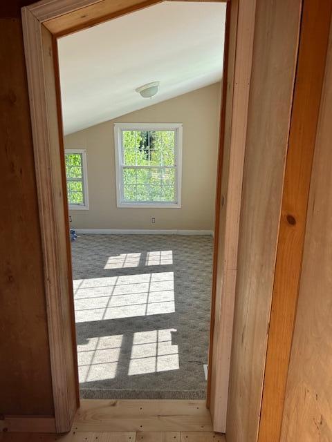 20 Monument Rd, Abbot, ME 04406 - spare room with vaulted ceiling and baseboards
