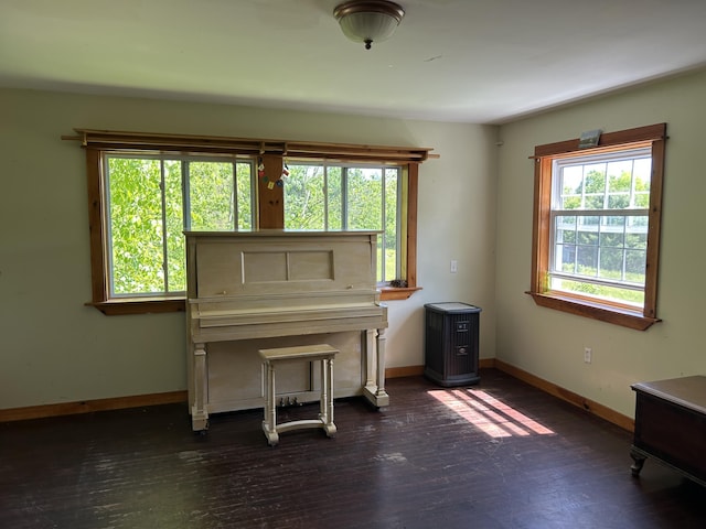20 Monument Rd, Abbot, ME 04406 - sitting room with baseboards and dark wood finished floors