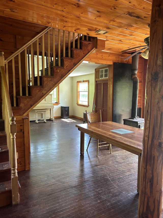 20 Monument Rd, Abbot, ME 04406 - unfurnished office with a wood stove, wooden ceiling, hardwood / wood-style floors, and baseboards