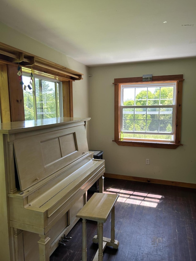 20 Monument Rd, Abbot, ME 04406 - living area featuring dark wood-style floors and baseboards