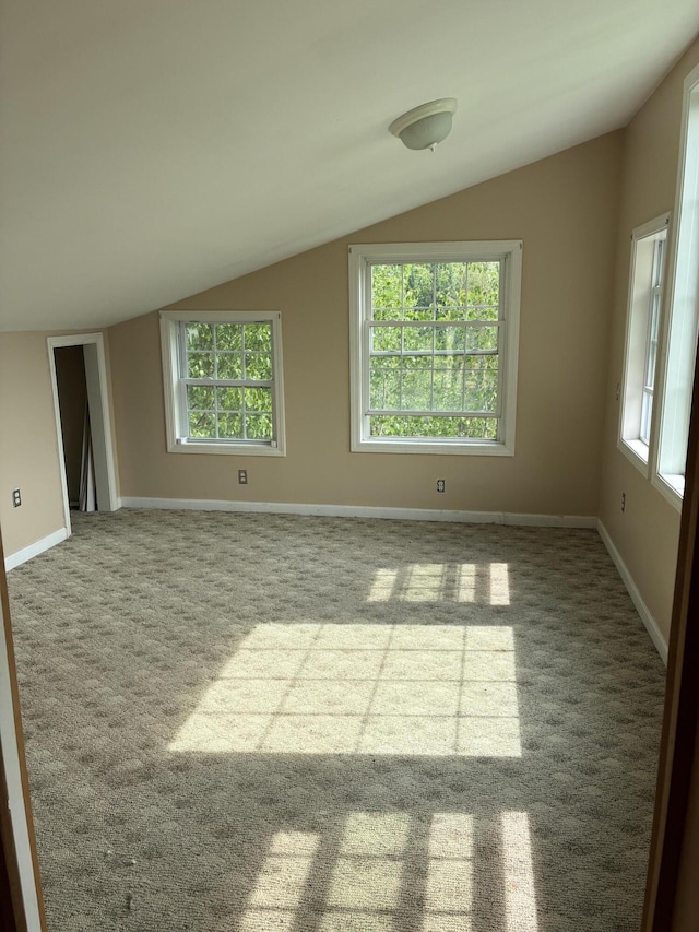 20 Monument Rd, Abbot, ME 04406 - spare room featuring lofted ceiling, carpet floors, and baseboards
