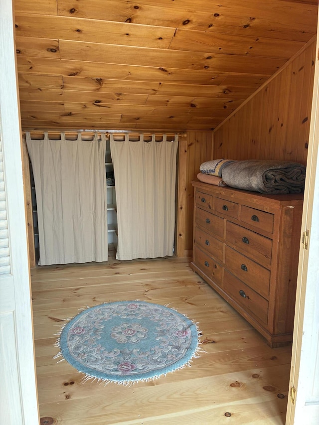 20 Monument Rd, Abbot, ME 04406 - bedroom featuring wood ceiling, vaulted ceiling, light wood-style floors, and wood walls