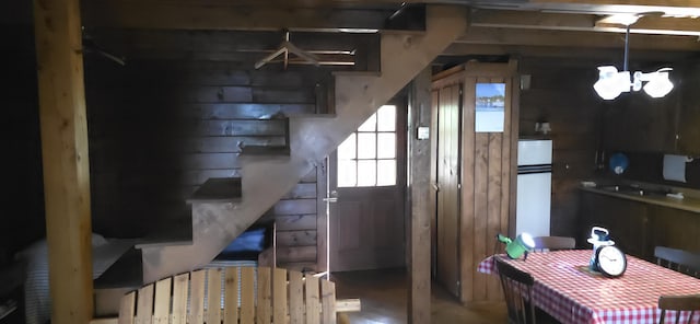 1261 Turkey Tail Rd Unit T4, Indian Purchase Twp, ME 04462 - staircase with a chandelier