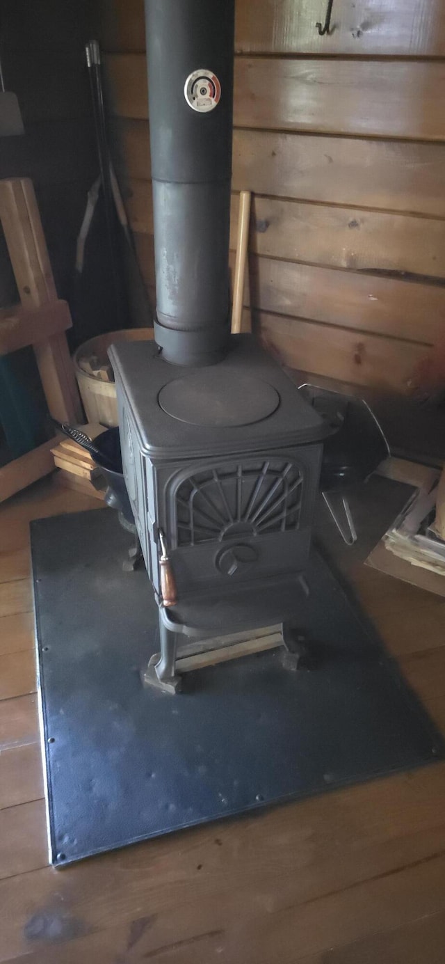 1261 Turkey Tail Rd Unit T4, Indian Purchase Twp, ME 04462 - detailed view of a wood stove and wood finished floors