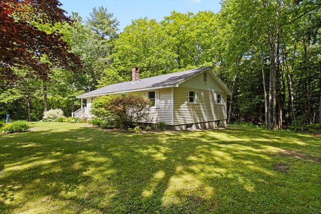 30 Ring Landing Rd, Casco, ME 04015 - view of property exterior featuring a chimney and a yard