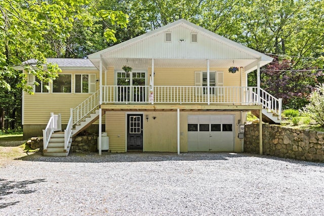 30 Ring Landing Rd, Casco, ME 04015 - view of front of property featuring stairs, an attached garage, and gravel driveway