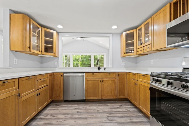30 Ring Landing Rd, Casco, ME 04015 - kitchen with appliances with stainless steel finishes, a ceiling fan, vaulted ceiling, light wood-type flooring, and light countertops
