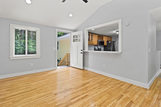 30 Ring Landing Rd, Casco, ME 04015 - unfurnished living room with light wood-style floors, a ceiling fan, vaulted ceiling, baseboards, and recessed lighting