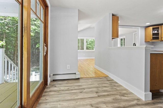 30 Ring Landing Rd, Casco, ME 04015 - interior space with a baseboard heating unit, light wood finished floors, and baseboards
