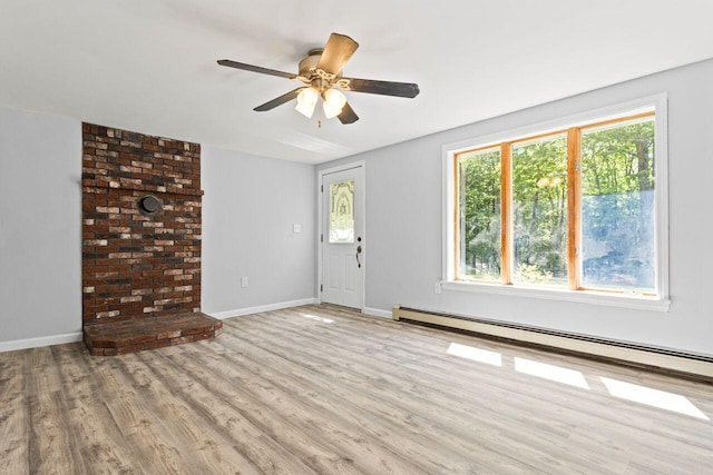 30 Ring Landing Rd, Casco, ME 04015 - unfurnished living room with healthy amount of natural light, light wood-style flooring, baseboard heating, and a ceiling fan