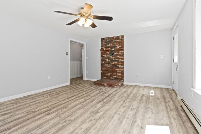 30 Ring Landing Rd, Casco, ME 04015 - empty room with a baseboard radiator, light wood-type flooring, ceiling fan, and baseboards
