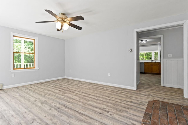 30 Ring Landing Rd, Casco, ME 04015 - unfurnished room with wood finished floors, a ceiling fan, and baseboards