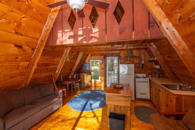 74 Snow Village Rd, Liberty, ME 04949 - living room with hardwood / wood-style flooring, vaulted ceiling, wooden ceiling, a ceiling fan, and wooden walls