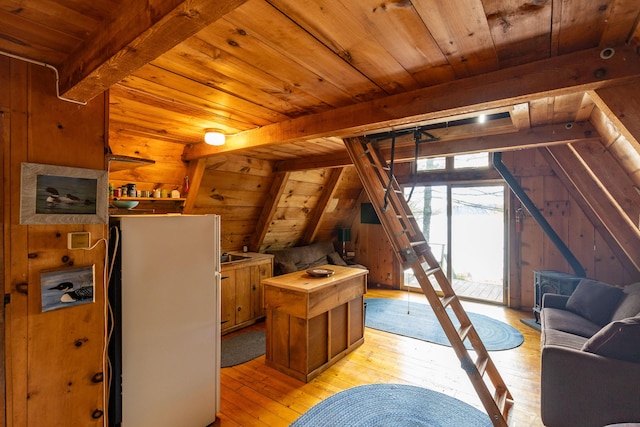 74 Snow Village Rd, Liberty, ME 04949 - interior space with wood ceiling, light wood-style flooring, wooden walls, freestanding refrigerator, and access to outside