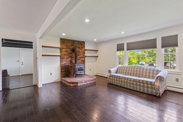 18 Tibbetts Ln, Lyman, ME 04002 - living area featuring a baseboard heating unit, a wood stove, hardwood / wood-style flooring, and recessed lighting