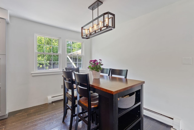 18 Tibbetts Ln, Lyman, ME 04002 - dining space with a baseboard radiator, a baseboard heating unit, a chandelier, and dark wood-style floors